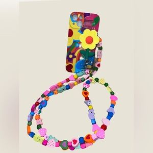 Colorful phone case with colorful crossbody strap.